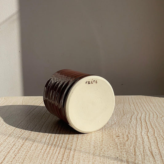 cup with frete written on the bottom