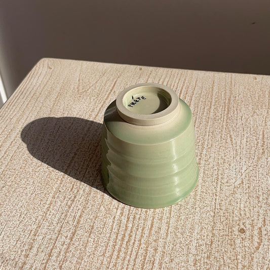 green small cup upside down