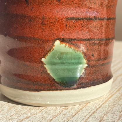 Close-up of a ceramic cup with a textured surface 