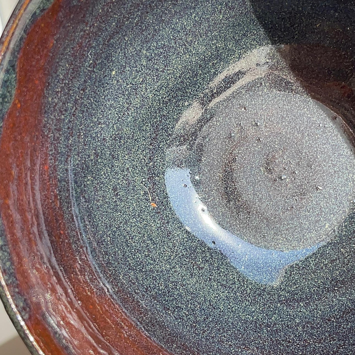 Close-up of a ceramic bowl with a textured surface