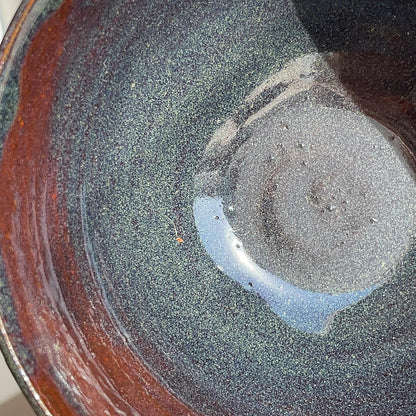 Close-up of a ceramic bowl with a textured surface