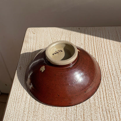 red ceramic bowl upside down